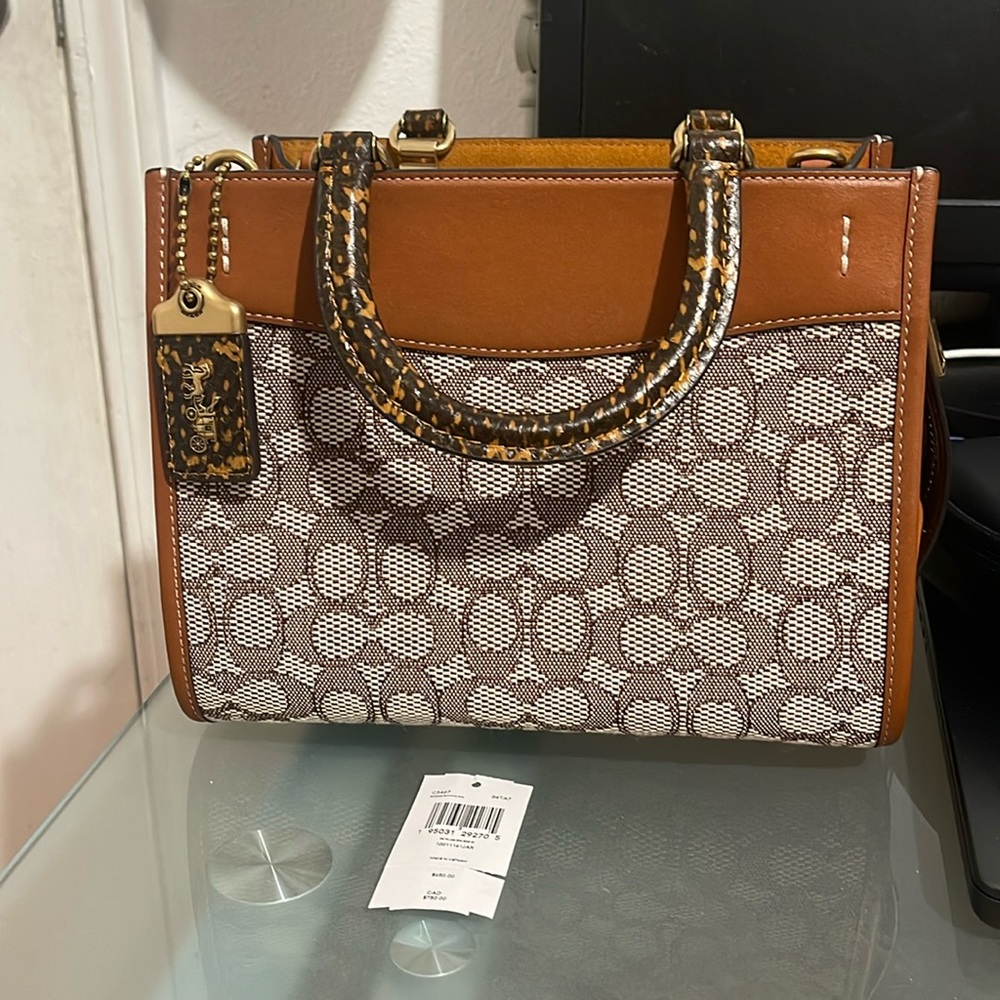 Coach rogue 25 with snakeskin handle.